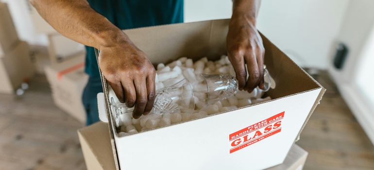 Things to Do in Indian Hill Ohio 3 Professional movers carefully handling expensive items during a move.