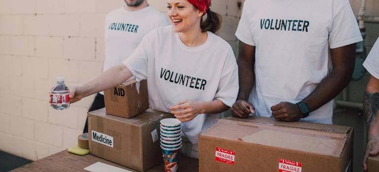 How greater Cincinnati celebrates Thanksgiving: Traditions, events, and local favorites 4 Volunteers distributing supplies at a community drive