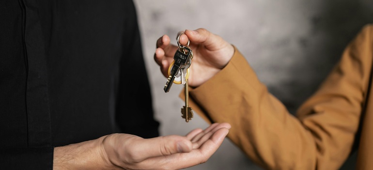 Pros and cons of living near US 22 9 a person getting keys to their new home, ready for living near US 22