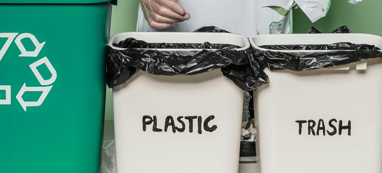 How to dispose of leftover packing materials after moving to Cincinnati? 2 Plastic and trash bins for post-move waste sorting