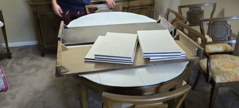 What packing materials are worth buying, and what can you skip? 2 Table packed with cardboard pieces for moving